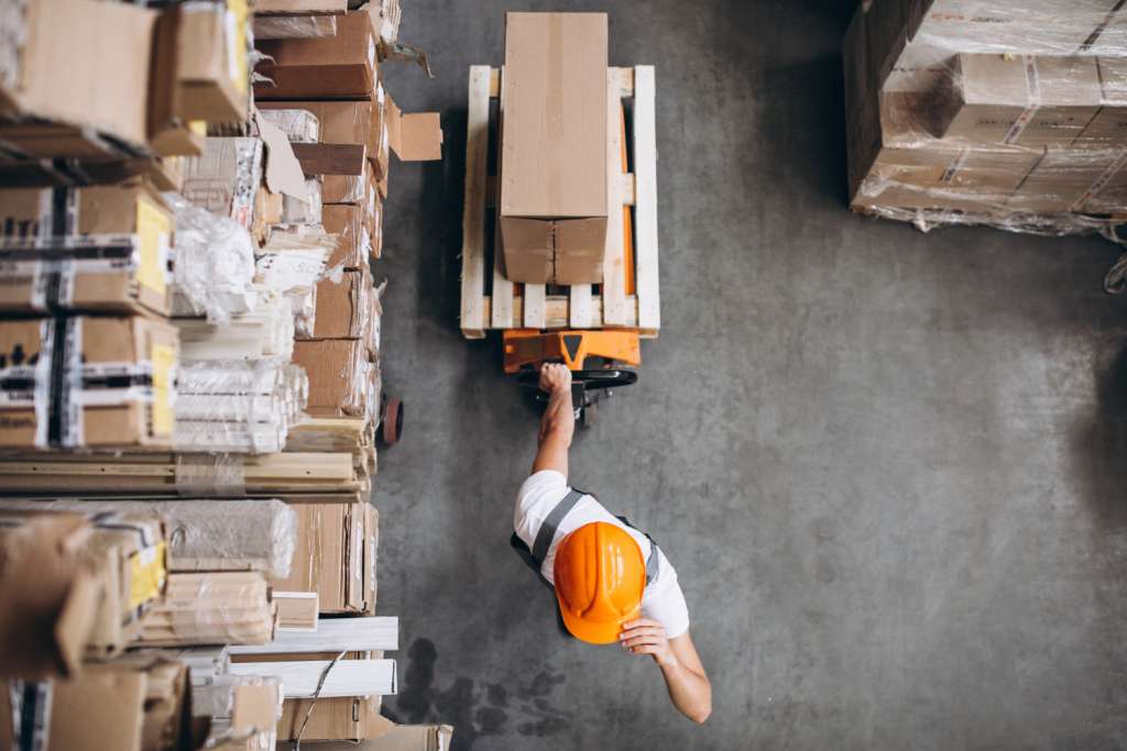 young-man-working-at-a-warehouse-with-boxes